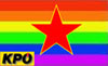 Logo der Parteigruppe red:out! - roter Stern und Schriftzug vor Fahne in Regenbogenfarben
